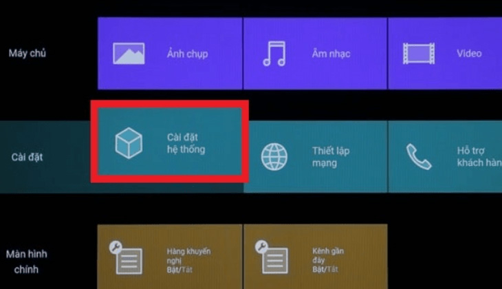 Bước 1: Trên remote điều khiển tivi chọn nút Cài đặt. Tiếp tục, chọn Cài đặt hệ thống