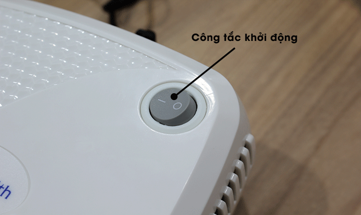 Nhấn nút để khởi động máy