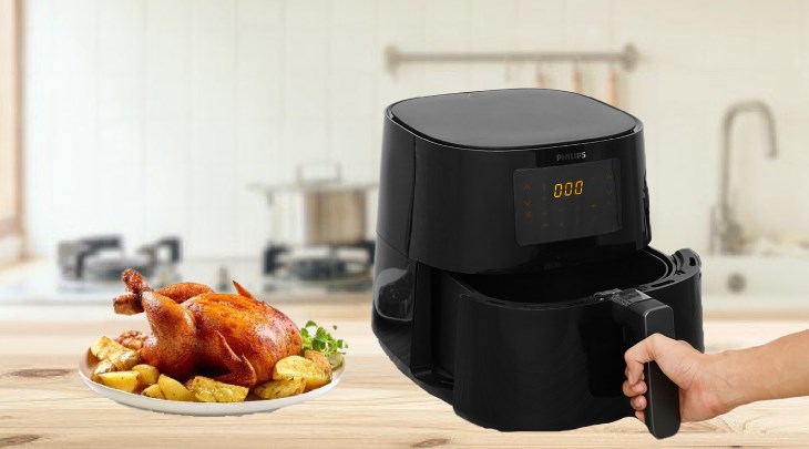 Bạn kéo nhẹ giỏ nồi chiên không dầu Philips HD9280/90 6.2 lít ra khỏi thiết bị để tránh làm trầy xước nồi