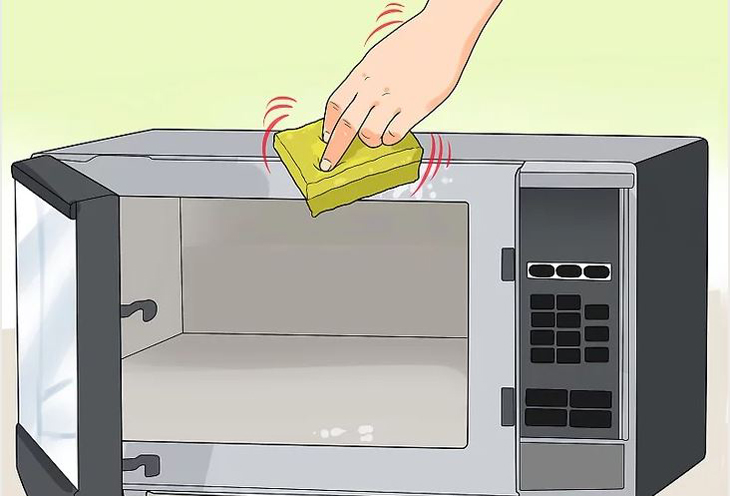 Sử dụng miếng bọt biển hoặc khăn giấy để làm sạch bên ngoài lò vi sóng